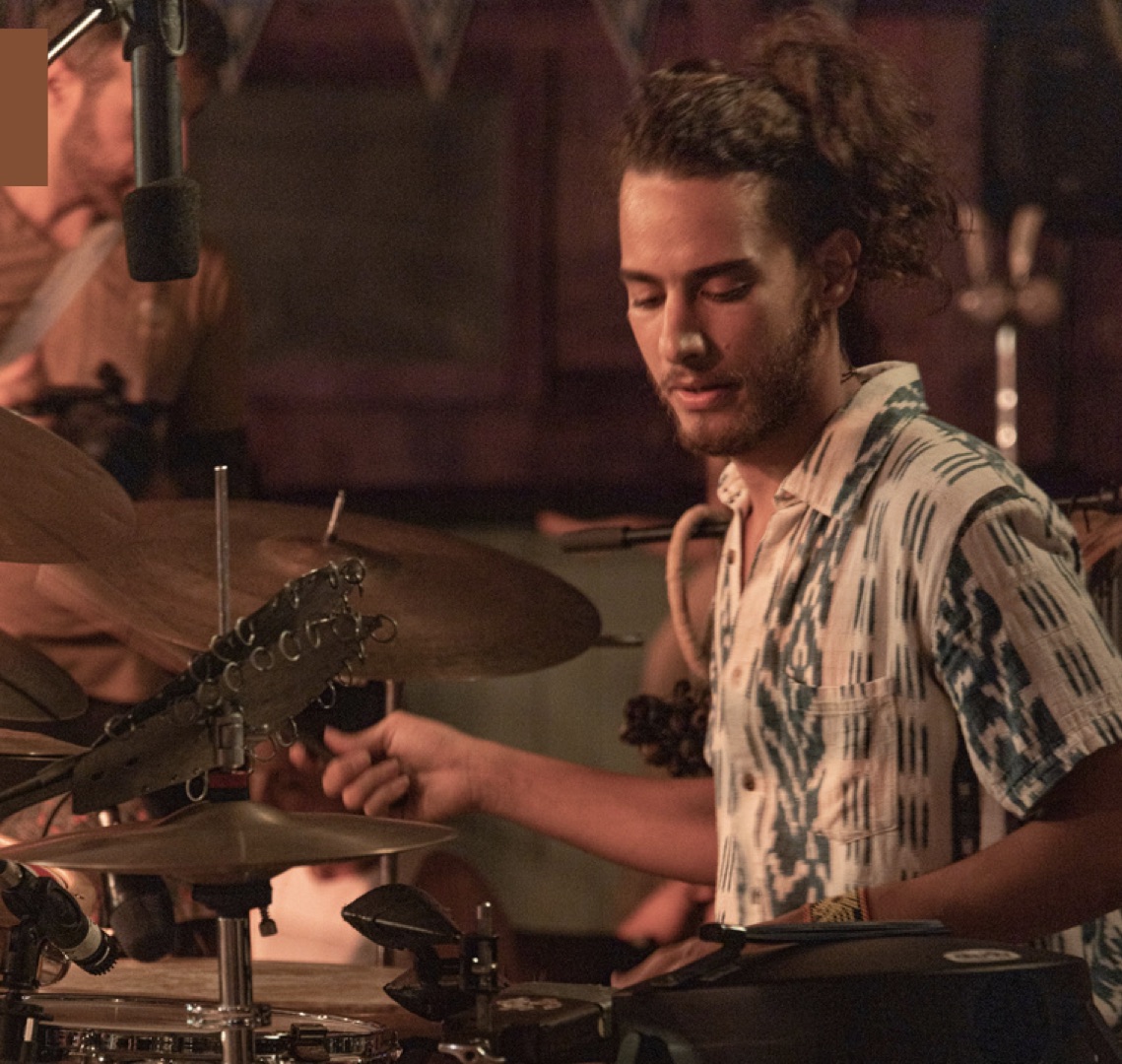 Ben Ben Franklin playing drums on stage